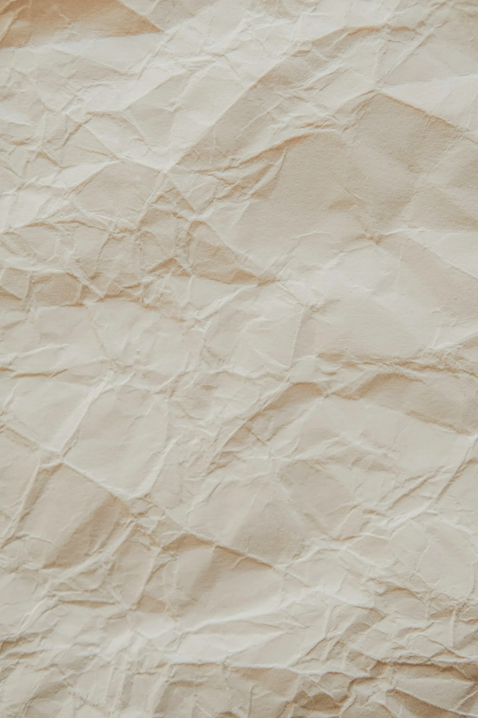 crumpled beige parchment paper texture