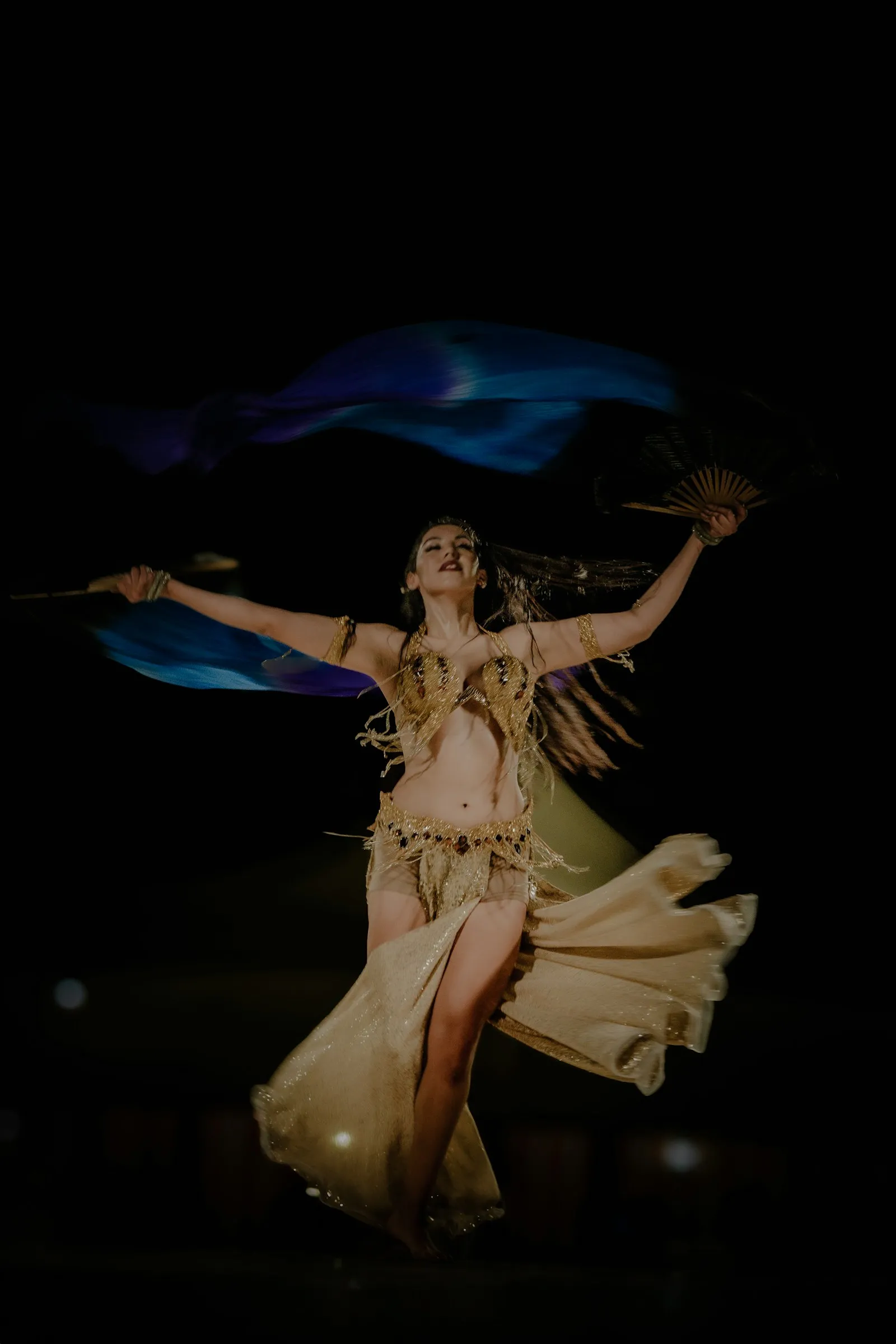 Photo by Akshaya Jayaprakash A woman in a belly dance costume is dancing